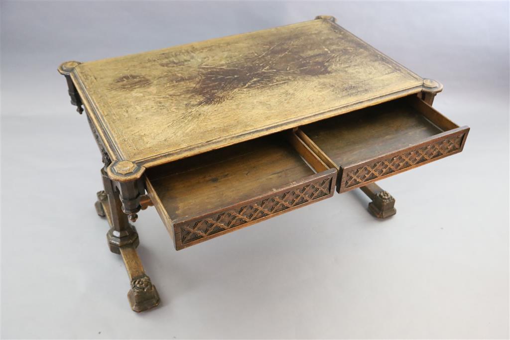 Attributed A.W.N. Pugin, A Victorian oak Gothic revival writing table, W.4ft 5.5in D.2ft 9.5in. H.2ft 6in.